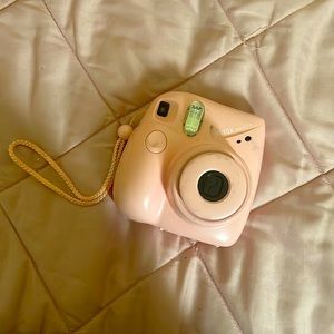pink polaroid with film pack